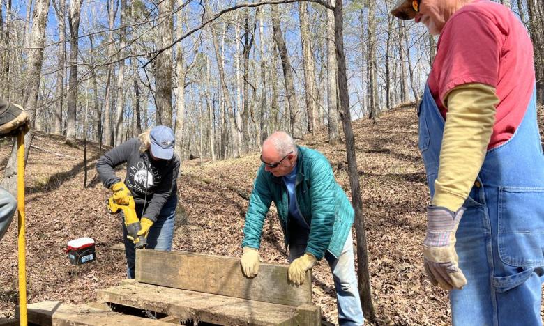 Volunteers working during the A Year to Volunteer project at Cane Creek State Park.
